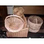 A collection of wicker baskets and teddy bear