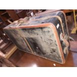 A vintage suitcase including two hangers marked 'WILT TRUNK CO. EST 1862 CHICAGO'