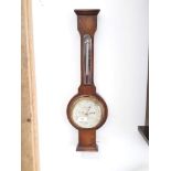 An oak cased barometer by Short & Mason, London.