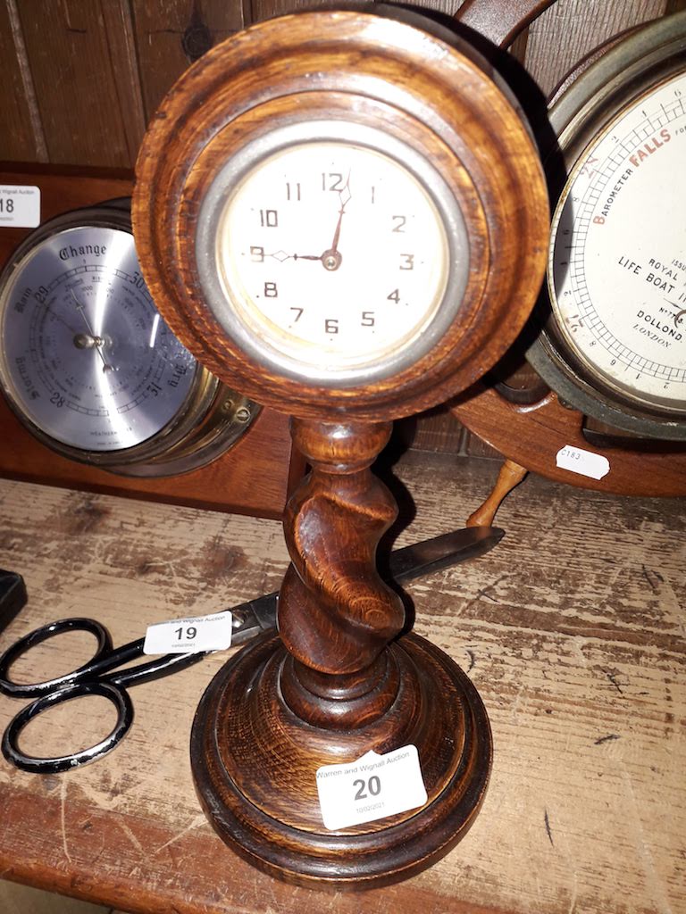 An oak clock on a twist stem