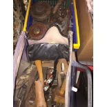 A crate of tools including bike spanners and a bag of woodworking tools