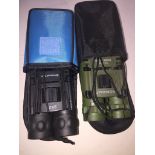A bag containing 2 small binoculars with cases