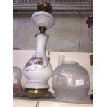 Tall milk glass oil lamp with funnel and clear glass shade