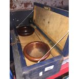 A wooden box containing 2 fitted, turned wooden bowls