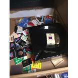 A box containing an ashtray, 3 lighters and various book matches
