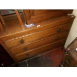 An oak chest of drawers.