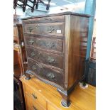 A reproduction bachelors chest with brushing slide.