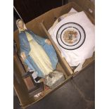A box of religious items including plaster figure of Mary, crucifix, and some collectors plates