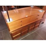 A Nathan teak sideboard with two drawers above cupboard on solid base, H74cm W102cm, together with a