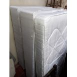 A pair of single divan beds and mattresses.