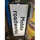 A mobile roadworks sign