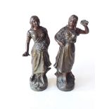 A pair of spelter figures with bronze finish, height 29cm.