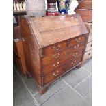 A Georgian oak bureau with fitted interior, brass handles and bracket feet, width 109cm, depth