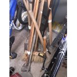 Various old garden and related tools including a pick axe, shears, hand scythe, hoes, spades,
