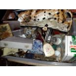 A box of misc. including a pottery leopard, treen metalware, Doulton Dickens, tins etc.