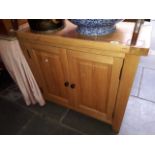 A light oak cabinet.