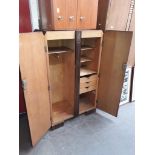 A 1930s oak compactum tallboy, width 84cm, depth 49cm & height 140cm.