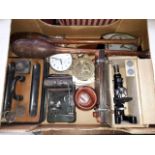 A box of various items including cased microscope, ink stand, clubs, clocks, etc