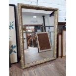 A large early 20th century giltwood framed mirror, 81cm x 55cm.