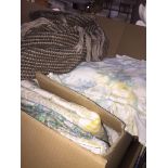 A box of bedding including quilt covers, pillow etc