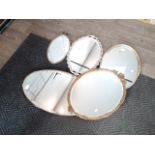 Five oval mirrors