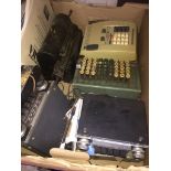 A box containing 2 comptometers, 4 car radios etc