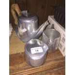 A Three piece Piquot Ware tea set