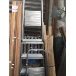 2 sets of aluminium ladders and a set of wooden ladders