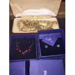 A mixed lot of costume jewellery comprising a vintage Trifari necklace and bracelet set, Swarovski