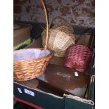A box containing small wicker baskets
