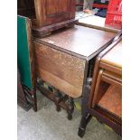 A barley twist leg oak drop leaf table.