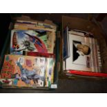Two boxes of books, comics and LPs.