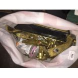 A bag of brass door furniture