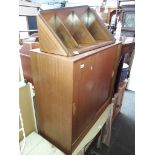 A teak cabinet by Gibbs and an open teak corner bookcase.