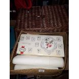 A basket of haberdashery and picnic type basket.