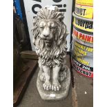 A concrete lion garden ornament