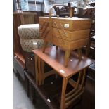 Four items of vintage furniture comprising a concertina sewing box, a light wood nest of tables,