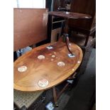 A good quality reproduction marquetry inlaid oval coffee table and another tripod table.