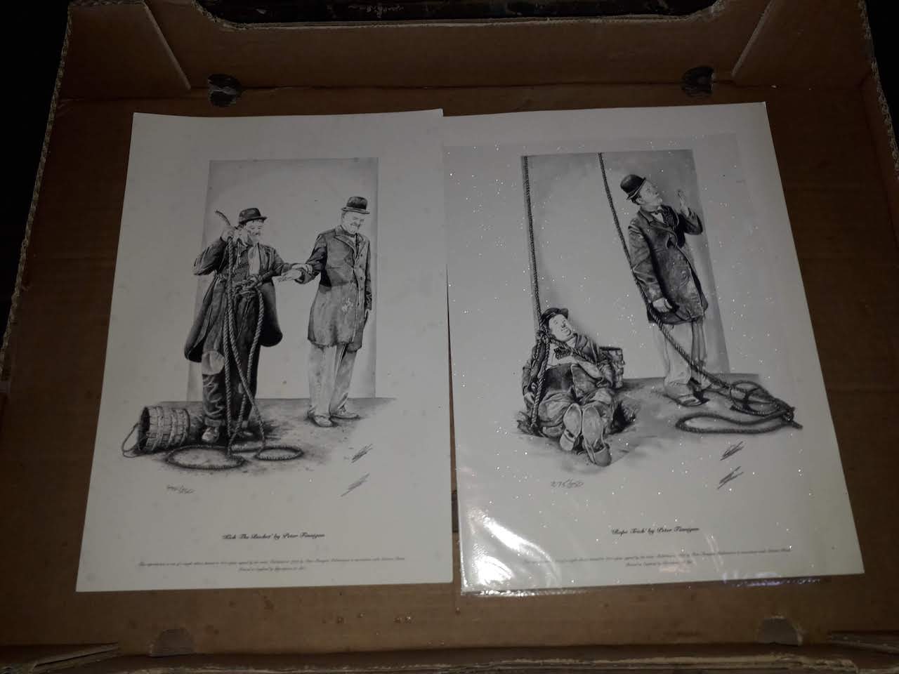 Two limited edition Laurel & Hardy prints.