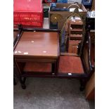 A teak nest of tables, a telephone table and a metal framed mirror.