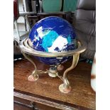 A multi-gemstone globe in brass frame, height 44cm.