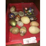 A box of vintage marbles and eggs.
