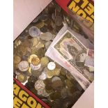 A box of world coins and bank notes