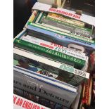 A box of books relating to golf