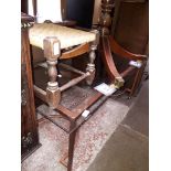 A bronze effect metal base glass top coffee table and a rush stool.