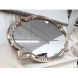 A large continental style reproduction mirror, H72cm, W110cm.