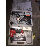 A pneumatic nailer and a soldering kit - both cased.