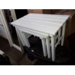 A white painted slatted nest of tables.