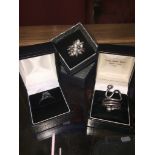 Three boxed silver rings