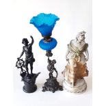 A mixed lot comprising a spelter figure, a figural oil lamp and a plaster figure, tallest 50cm.